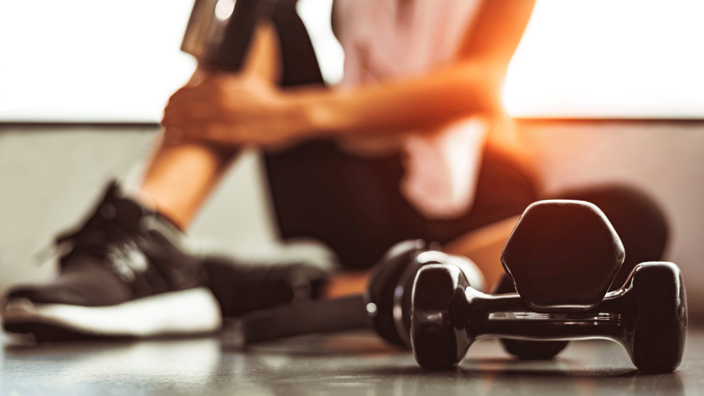 woman sitting with weights