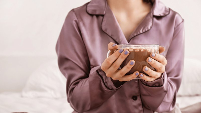 woman holding mug of hot chocolate